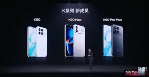 REDMI K90 Max手机正面特写,显示6.83英寸大屏、居中挖孔前置摄像头,机身配色为深色渐变,屏幕亮起显示游戏界面与165Hz刷新率标识